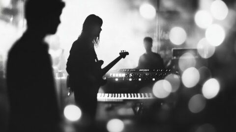Black and White photo of three musician in a recording studio